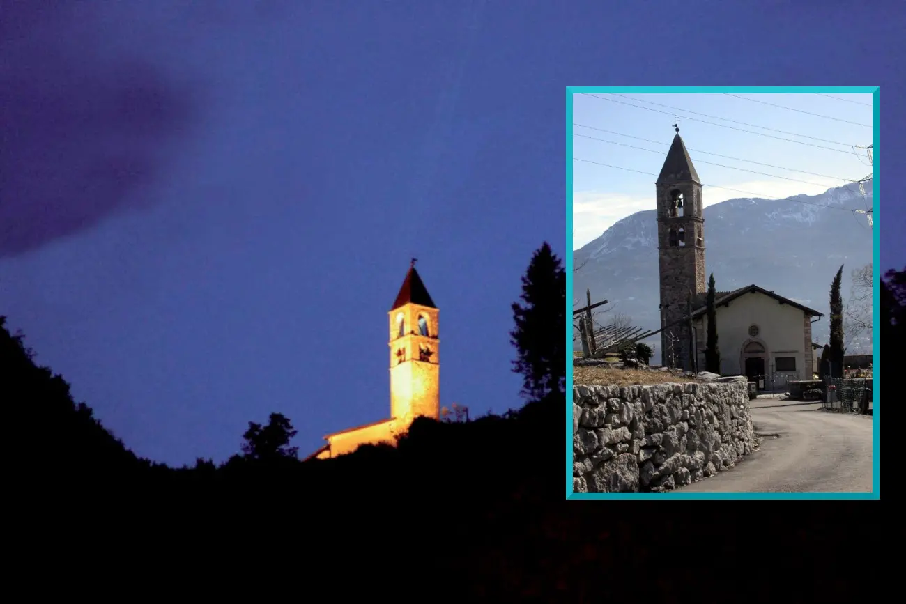 suggestiva veduta notturna della Chiesa dei SS. Filippo e Giacomo (XIII secolo, affreschi di Fogolino) di Sardagna, che sorge vicino alla cascata ed e' ben visibile dalla citta' di Trento