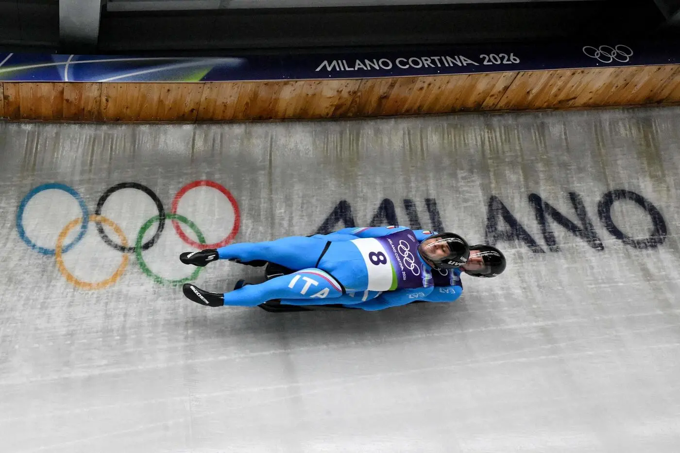 Italy's Emanuel Rieder and Italy's Simon Kainzwaldner compete in the luge men's doubles run 1 at Cortina Sliding Centre during the Milano Cortina 2026 Winter Olympic Games in Cortina d'Ampezzo on February 11, 2026. (Photo by Tiziana FABI / AFP)