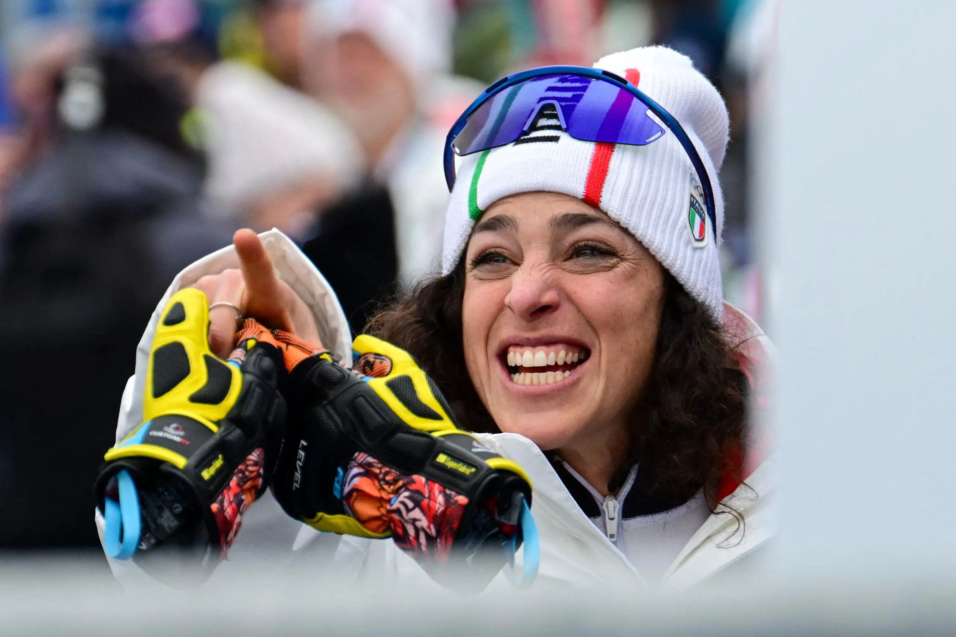 Italy's Federica Brignone gestures in the finish area of the women's super-G event during the Milano Cortina 2026 Winter Olympic Games at the Tofane Alpine Skiing Centre in Cortina d